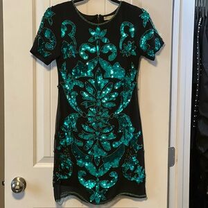 Elegant Black Dress with Teal Sequin Design